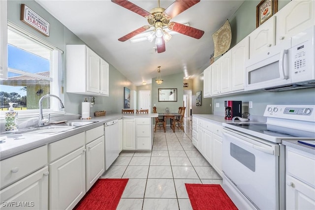 kitchen with white cabinets, white appliances, and sink