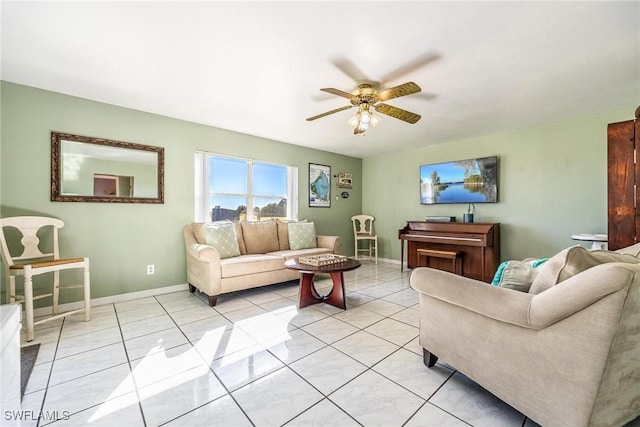 living room with ceiling fan and light tile patterned floors