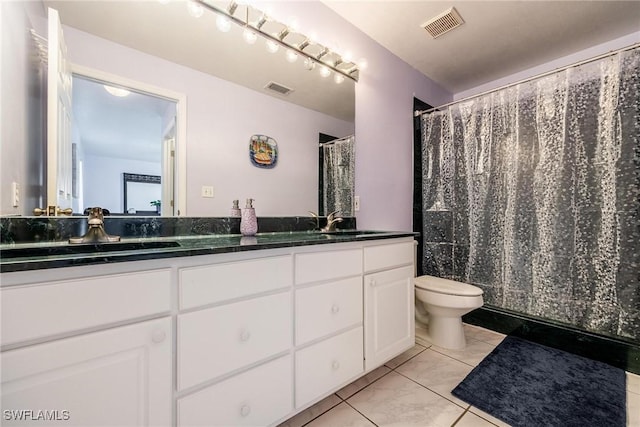 bathroom featuring tile patterned floors, vanity, toilet, and a shower with curtain