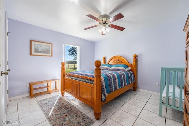 tiled bedroom with ceiling fan