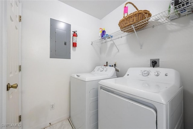 laundry room with separate washer and dryer and electric panel