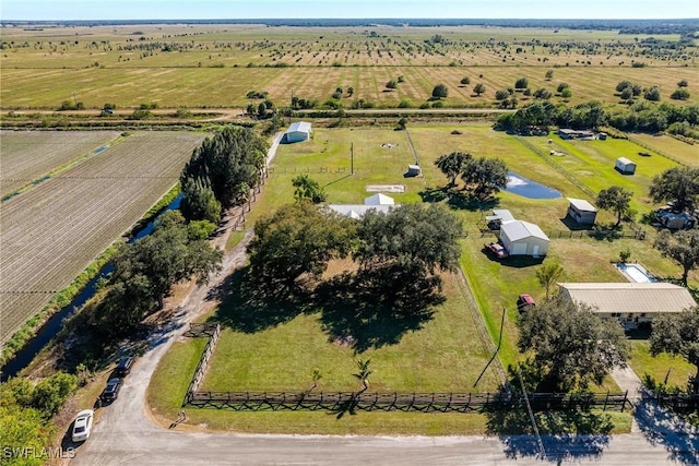 aerial view featuring a rural view and a water view