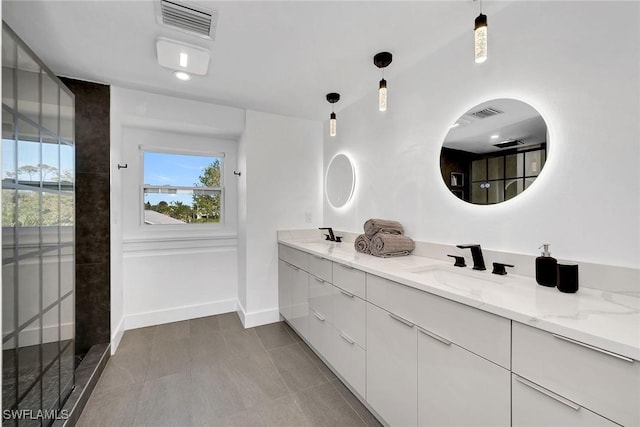 bathroom with tile patterned flooring and vanity