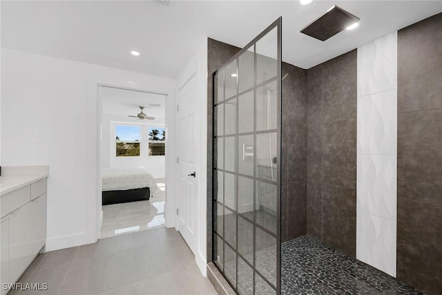 bathroom with a tile shower, tile patterned floors, and ceiling fan