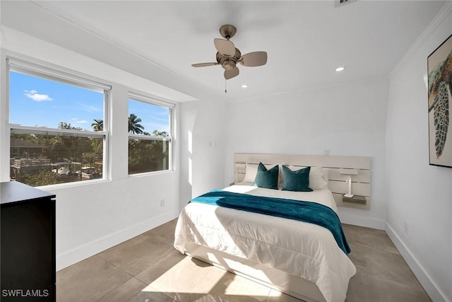 tiled bedroom with ceiling fan and ornamental molding