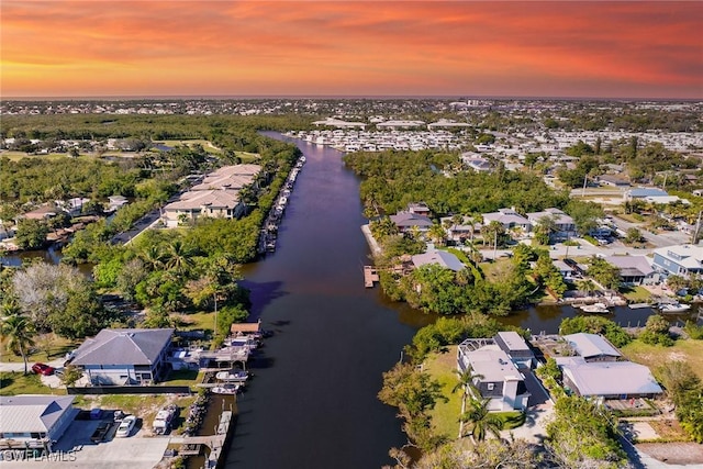 aerial view at dusk with a water view