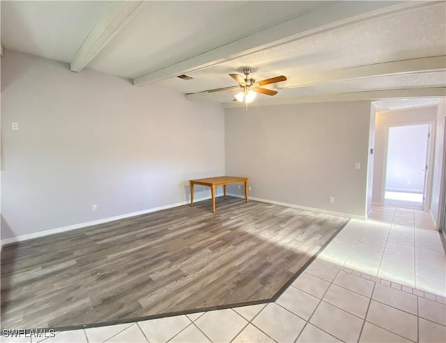 spare room with ceiling fan, beam ceiling, and light hardwood / wood-style flooring