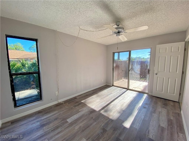 spare room featuring ceiling fan, wood-type flooring, and a textured ceiling