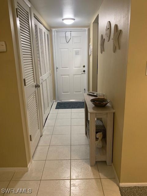 doorway featuring light tile patterned floors