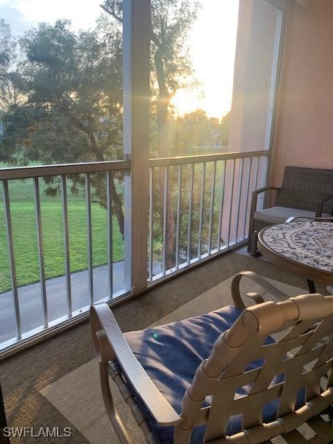 view of balcony at dusk