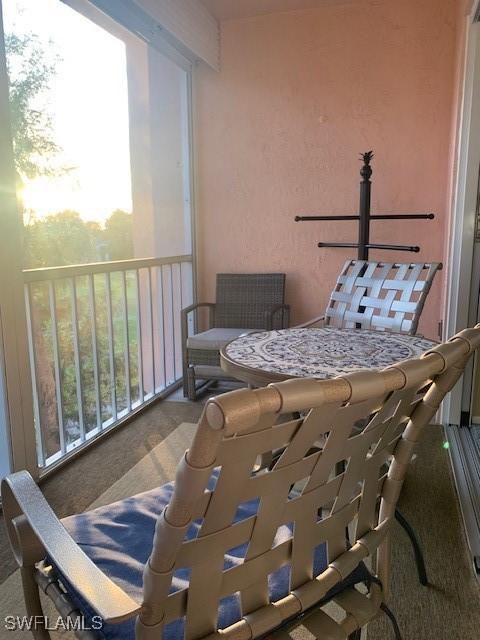 view of balcony at dusk