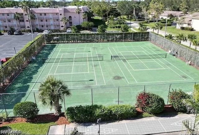 170 Turtle Lake Ct Unit 304, Naples, FL 34105 - view of sport court featuring a residential view and fence