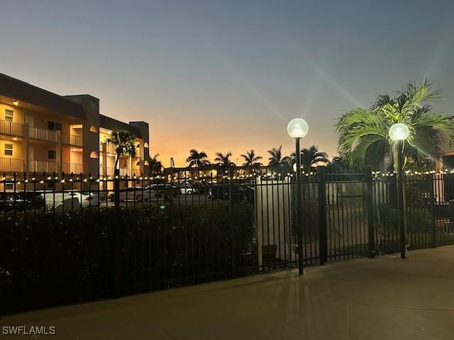 view of gate at dusk