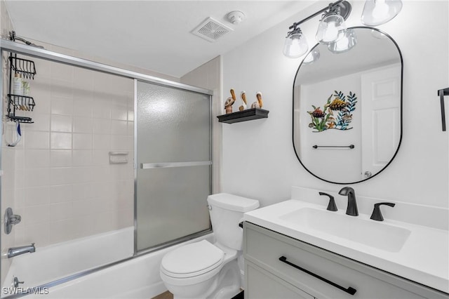 full bathroom with toilet, combined bath / shower with glass door, visible vents, and vanity