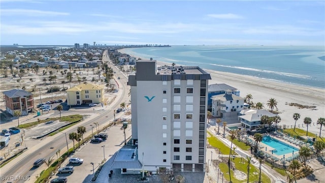 birds eye view of property with a view of the beach and a water view