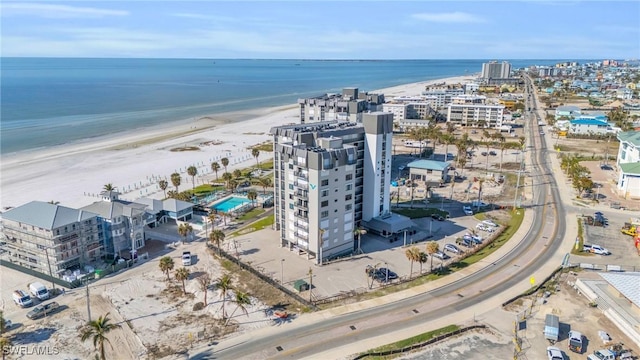 aerial view featuring a beach view, a water view, and a city view