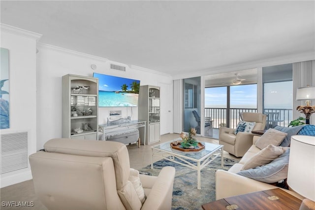 living area featuring visible vents and crown molding