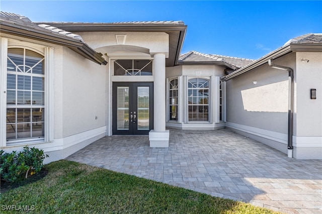 doorway to property featuring french doors