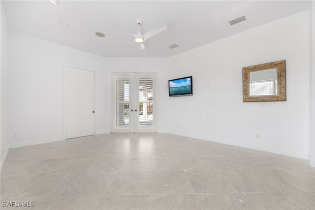 unfurnished room featuring ceiling fan and french doors