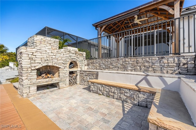 view of patio featuring exterior fireplace