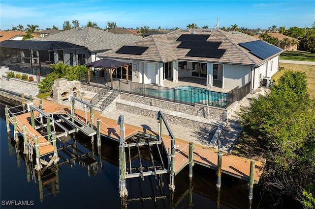 rear view of property featuring a patio and a water view