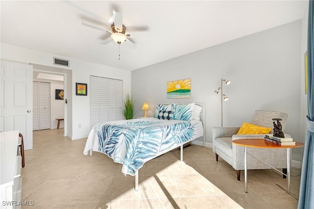 bedroom with ceiling fan and light tile patterned floors