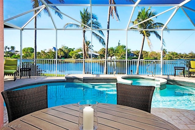 view of swimming pool with a lanai, a patio area, an in ground hot tub, and a water view