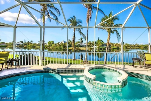 view of pool featuring a lanai, an in ground hot tub, and a water view