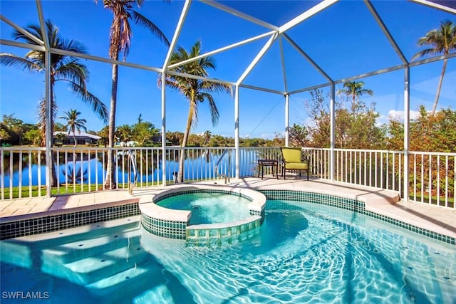 view of swimming pool with a lanai, an in ground hot tub, and a water view