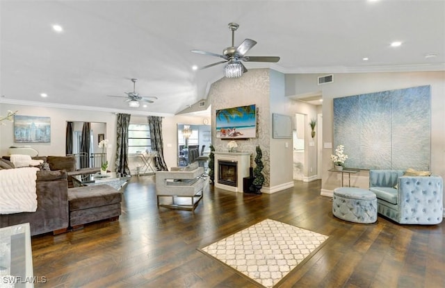 living room with dark hardwood / wood-style floors, vaulted ceiling, ceiling fan, and ornamental molding