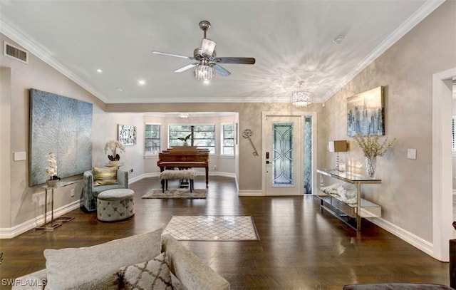 entryway with dark hardwood / wood-style flooring, ceiling fan with notable chandelier, and ornamental molding