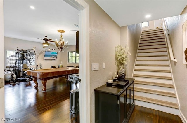 staircase featuring hardwood / wood-style flooring, ceiling fan, and pool table