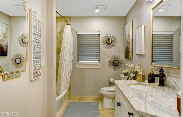 full bathroom featuring tile patterned flooring, vanity, shower / bath combination with curtain, and toilet