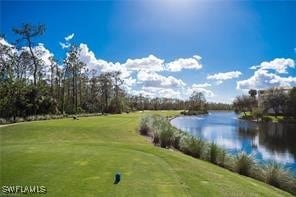 surrounding community featuring a water view