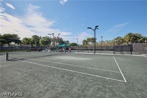 view of tennis court with fence