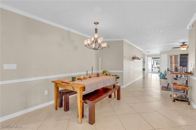 dining space featuring ornamental molding, ceiling fan with notable chandelier, baseboards, and light tile patterned floors