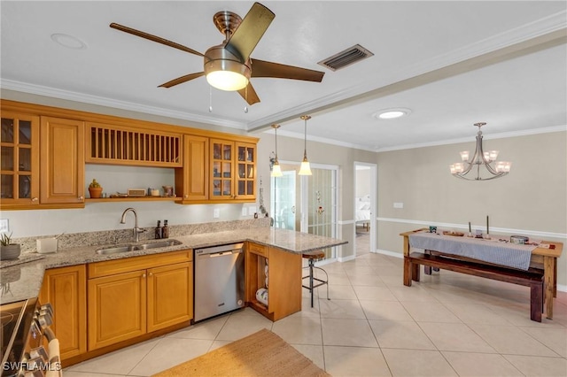 kitchen featuring stainless steel appliances, a sink, visible vents, and brown cabinets