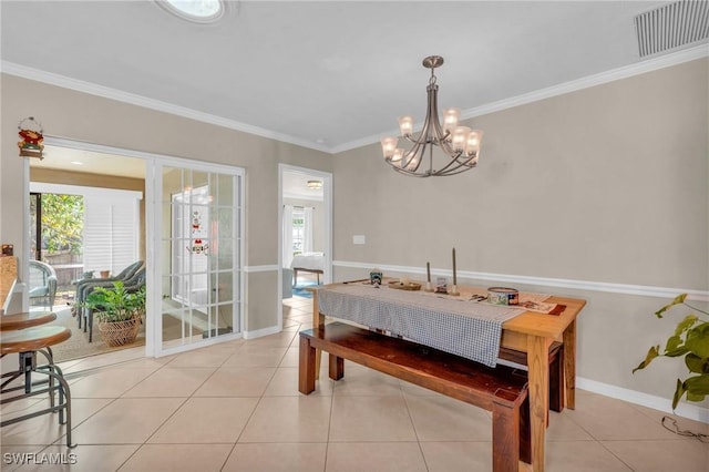 dining area featuring a wealth of natural light, light tile patterned flooring, and visible vents