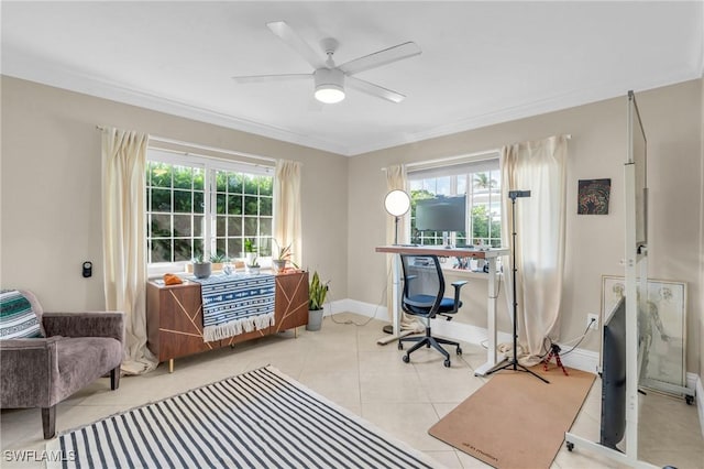 office area featuring ornamental molding, light tile patterned flooring, ceiling fan, and baseboards