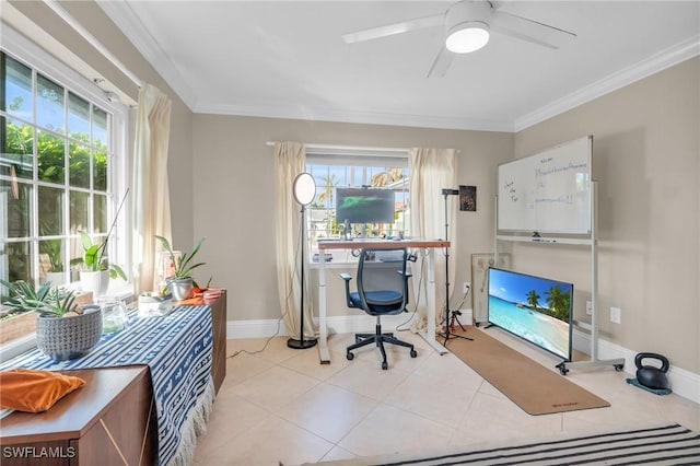 office area with ornamental molding, a wealth of natural light, baseboards, and light tile patterned floors