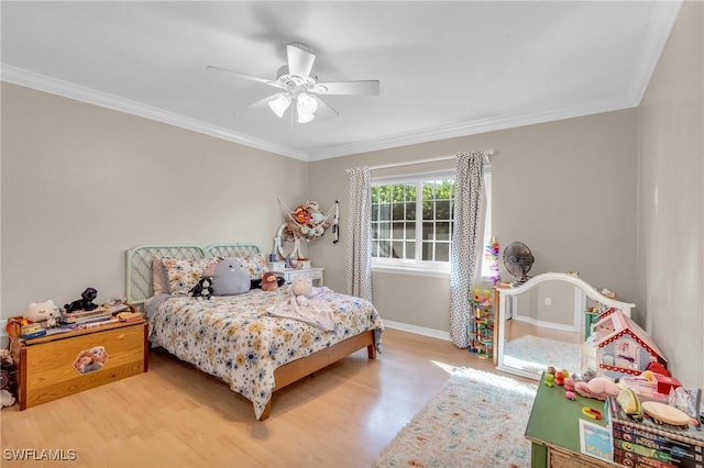 bedroom featuring baseboards, ornamental molding, ceiling fan, and wood finished floors