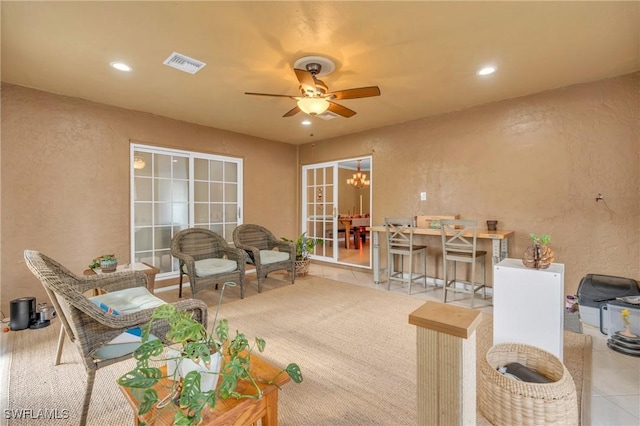 view of patio featuring a ceiling fan and visible vents