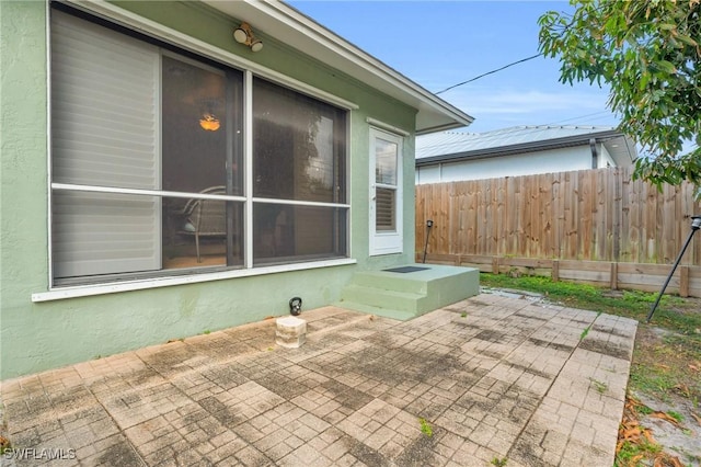 view of patio featuring fence