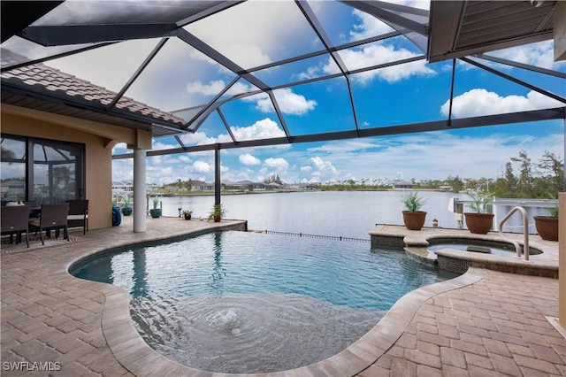 view of pool with a lanai, a water view, an in ground hot tub, and a patio