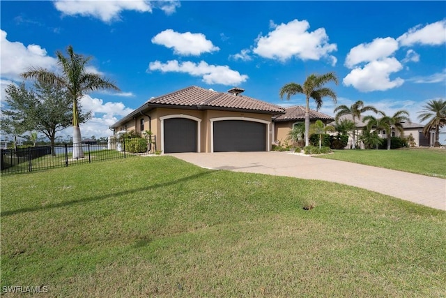 mediterranean / spanish-style home with a garage and a front lawn