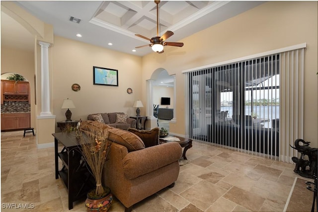 living room featuring ceiling fan, ornate columns, ornamental molding, and coffered ceiling