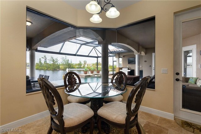 dining area featuring a notable chandelier