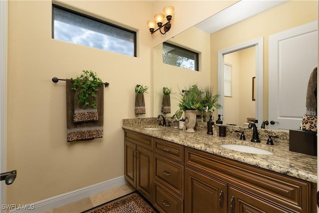 bathroom featuring tile patterned flooring and vanity