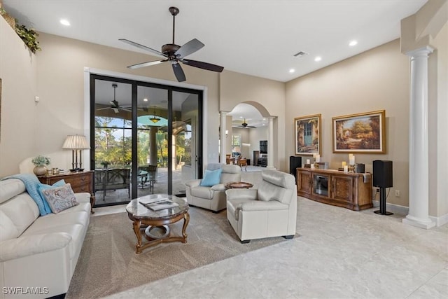 living room featuring ornate columns