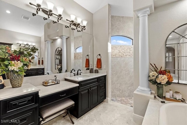 bathroom with vanity, shower with separate bathtub, and decorative columns